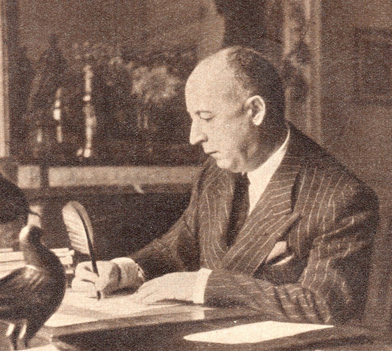 Christian Dior at his desk, 1954